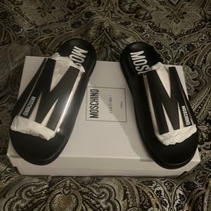 Brand new…Woman Moschino slides that never been worn and comes with box!